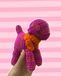 Purple and pink stripe puppy with orange scarf