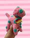 Pink and blue polkadot puppy with striped scarf